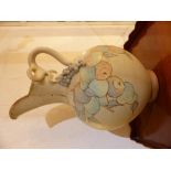 An impressive Port Isaac pottery jug, with a sinuous grape vine handle, the body decorated with