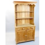 Victorian style pine dresser with boarded rack over two drawers and panelled cupboard base, 102cm