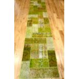 Irish green ground patchwork runner, 400cm l, 83cm w