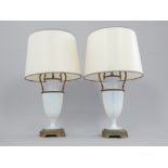 Pair of early 20th century white opaque glass table lamps, of baluster form with brass mounts,