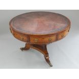 Regency rosewood library / study revolving drum table, claret leather embossed insert,