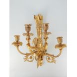 Gilt bronze four branch wall light, with quiver support and scrolling arms,