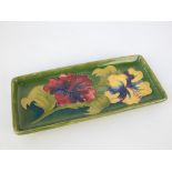 Moorcroft hibiscus pattern pen dish, of rectangular form, the base with impressed marks,