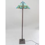 Tiffany style standard lamp, the square tapering shade on a fluted columnar support and square base,