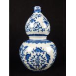 Chinese double gourd vase, blue and white glaze with bat and floral decoration,