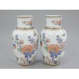 Pair of late 20th century German vases, of baluster form decorated with flowers and butterflies,