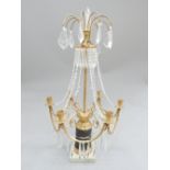 An impressive gilt metal and glass six branch candelabra, with drops and swags on a cylindrical