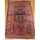 Persian prayer mat, geometric design over indigo ground, within reticulated borders, fringed,