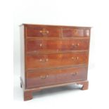 A 19th Century mahogany chest of two over three drawers, brass swan neck handles, bracket feet, 95.