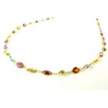 Mixed stone necklace set in 14ct yellow gold with topaz, peridot,