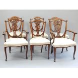 Set of six dining chairs, walnut, shield backs with carved floral and pierced vase splat, pad feet,
