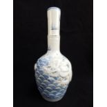 Chinese bud vase, blue and white glaze, applied dragon chasing flaming pearl over the seas,