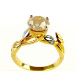 An unusual gold and solitaire ring, the round cut stone of approx 1.