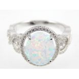Silver and cubic zirconia ring with oval white opalite stone