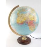 Illuminated globe, retailed by Michelin, dated 1996, raised on a circular wooden base, 40cm h,