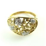 9ct yellow gold diamond cluster ring, the oval cartouche with pierced floral design, 3.