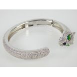 White metal and cubic zirconia bangle in the manner of Cartier,