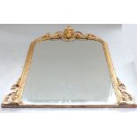 Victorian gilt framed overmantel mirror, the arched top with a cartouche and foliate swags,