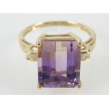 Amethyst dress ring with diamond set shoulders on an 18ct yellow gold band, 3.