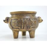 Miniature Chinese bronze censer, temple dog handles, bats and symbol decoration to sides,