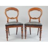 Pair of mahogany balloonback chairs, c 1900, scroll carving, bowfront Rexine seat,