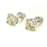 Pair of 18ct white gold illusion set diamond studs, 1.