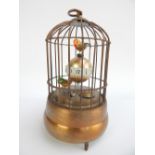 Automaton clock, modelled in the form of two caged birds,