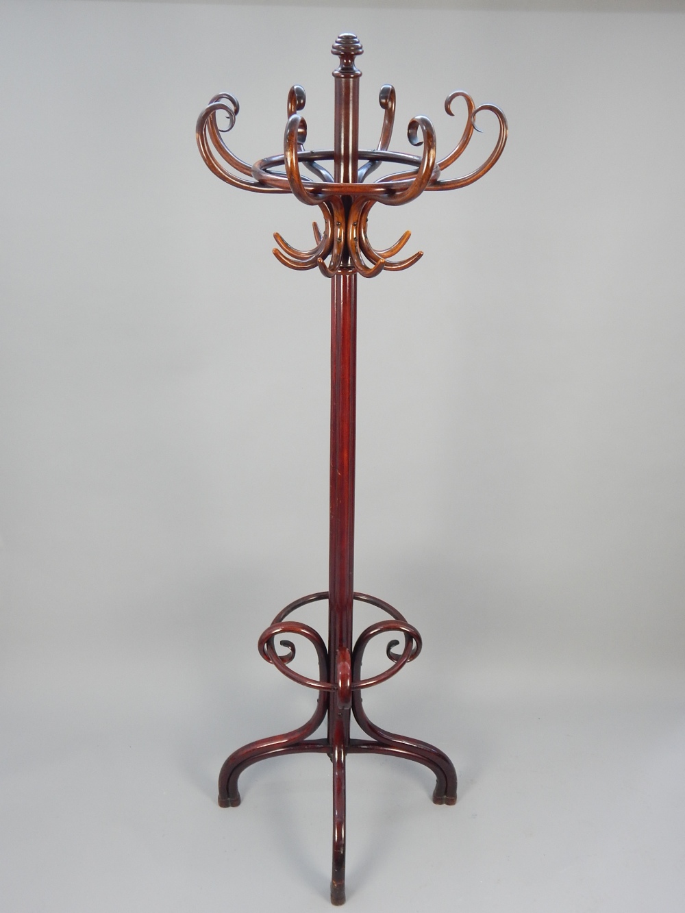 Thonet bentwood coat stand, the eight S-scroll hooks above a cluster column, on downswept legs,