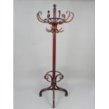 Thonet bentwood coat stand, the eight S-scroll hooks above a cluster column, on downswept legs,