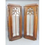 Pair of early 20th century oak pedestal cupboards,