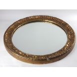 Art Nouveau style circular wall mirror, with a gilt leaf lappet frame,