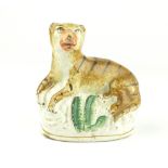 19th century Staffordshire style model of a recumbent tiger,