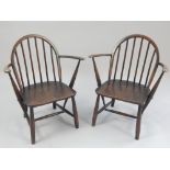 A pair of elm and beech children's Ercol armchairs,