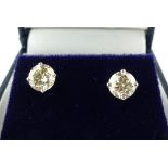 Pair of white gold diamond ear studs,