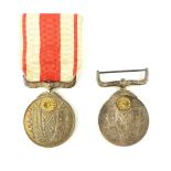 Imperial Japan Taisho Enthronement commemorative medals, c 1915, swivel suspension bar,