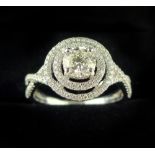 18ct white gold and diamond dress ring, central stone set within two diamond bands,