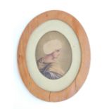 A antique watercolour portrait in profile of a young woman in a turban (oval 11x 8cm) in a pine