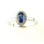 18ct white gold, sapphire and diamond cluster ring,