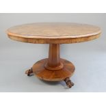 Victorian mahogany tilt top breakfast table, the segment veneered circular top above a faceted