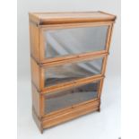 Oak Globe Wernicke sectional bookcase, with a top, base and three sections,