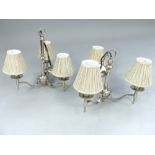 Pair of contemporary chrome plated three branch ceiling lights, the flat scroll arms terminating