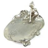 Art Nouvea style pewter card tray, modelled as a woman recumbent beside a lily pond,