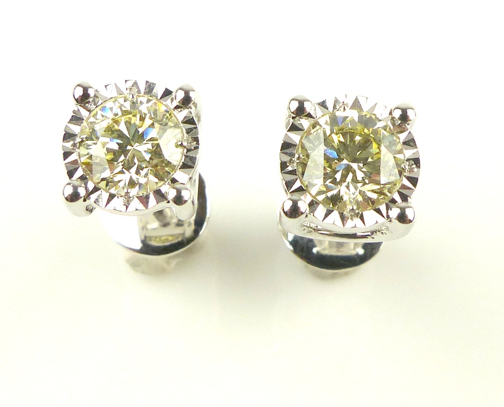 Pair of 18ct white gold illusion set diamond studs, 1. - Image 2 of 3