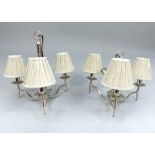 Pair of contemporary chrome plated three branch ceiling lights, the flat scroll arms terminating