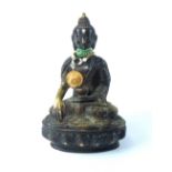 19th century bronze Buddha, seated with a bowl and raised on a lily pad,