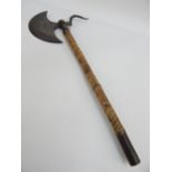 19th century Indian cermonial axe, neillo semi circular shaped blade, animal skin clad handle,