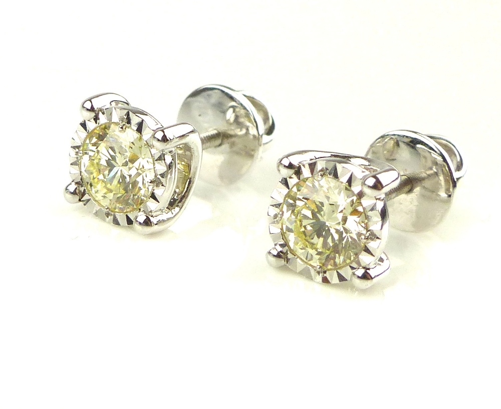 Pair of 18ct white gold illusion set diamond studs, 1.