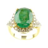 Emerald oval cut dress ring with a diamond surround, emerald of 6.93ct, diamonds 0.