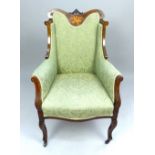 Edwardian wingback chair, mahogany with marquetry panel of musical instruments, floral carving,