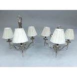 Pair of contemporary chrome plated three branch ceiling lights, the flat scroll arms terminating